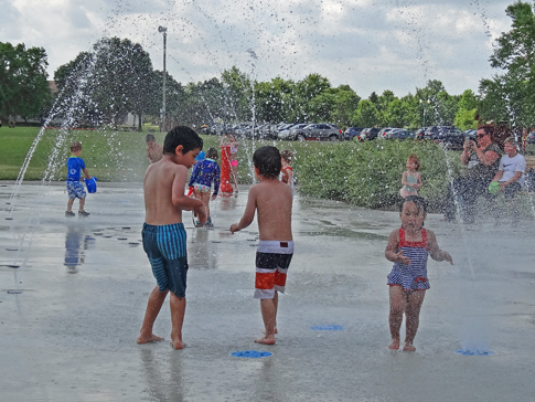 Asher, Timothy, and Everly at the splash