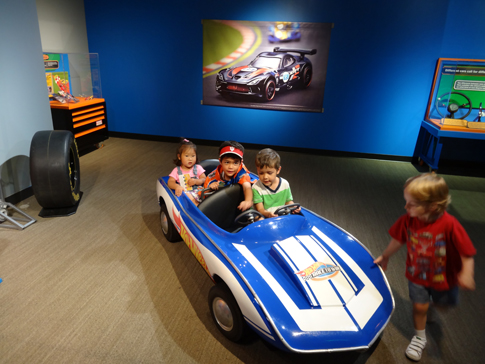 Everly, Asher, Timothy at the Hot Wheels exhibit in the Children's Museum of Indianapolis